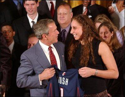 Congratulating the NCAA Winter Championship teams, President George W. Bush stands with Diana Taurasi of the University of Connecticut's women's basketball team in the East Room Tuesday, June 17, 2003. White House photo by Tina Hager
