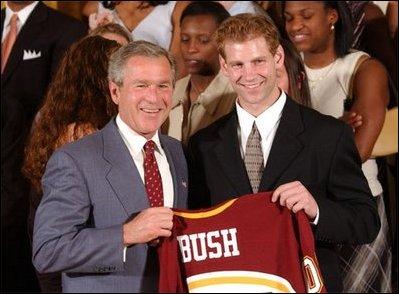 Congratulating the NCAA Winter Championship teams, President George W. Bush stands with Grant Potulny of the University of Minnesota-Twin Cities' men's hockey team in the East Room Tuesday, June 17, 2003. White House photo by Tina Hager