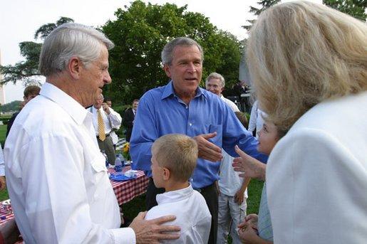 President George W. Bush greets guests at the Congressional Picnic on the South Lawn Wednesday, June 18, 2003. White House photo by Susan Sterner