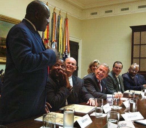 President George W. Bush listens to Robert Sutton, left, a graduate of the Prison Fellowship Ministries InnerChange Freedom Initiative, during a roundtable discussion in the Roosevelt Room Wednesday, June 18, 2003. The initiative is is part of the Texas Department of Criminal Justice System and the new prisoner reentry and treatment program proposed by the Department of Justice. White House photo by Tina Hager