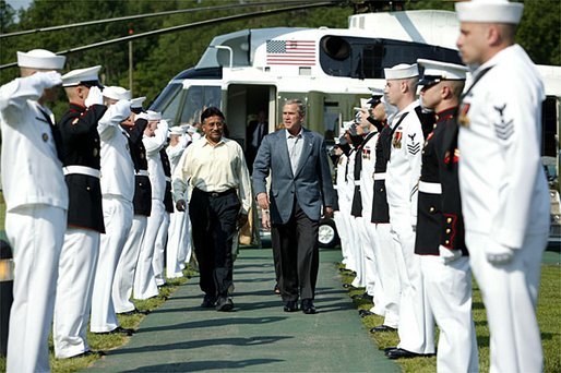 President George W. Bush welcomes President Pervez Musharraf of Pakistan to Camp David Tuesday, June 24, 2003. "Since September 11th attacks, Pakistan has apprehended more than 500 al Qaeda and Taliban terrorists -- thanks to the effective border security measures and law enforcement cooperation throughout the country, and thanks to the leadership of President Musharraf," said President Bush in his remarks. White House photo by David Bohrer