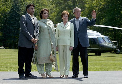 President Pervez Musharraf, his wife, Sehba Musharraf, President George W. Bush and Laura Bush stand for a group photo shortly after the press conference at Camp David Tuesday, June 24, 2003. White House photo by David Bohrer