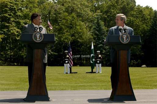 Presidents Pervez Musharraf of Pakistan and George W. Bush hold a joint press conference at Camp David Tuesday, June 24, 2003. "Greater economic development is also critical to fulfilling the hopes of the Pakistani people," said President Bush. "Since we met last year, the United States has cancelled $1 billion of debt Pakistan owed our country. And today I'm pleased to announce that our nations are signing a trade and investment framework agreement, which creates a formal structure for expanding our economic partnership." White House photo by David Bohrer