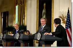 President George W. Bush, European Council President and Greek Prime Minister Konstandinos Simitis, left, and European Commission President Romano Prodi conduct a joint press conference in the East Room Wednesday, June 25, 2003. "We meet at an important moment, a time when the EU is taking in new members and writing a new constitution. And a time when both Europe and America are facing new challenges in the world's peace and prosperity," President Bush said.   White House photo by Susan Sterner