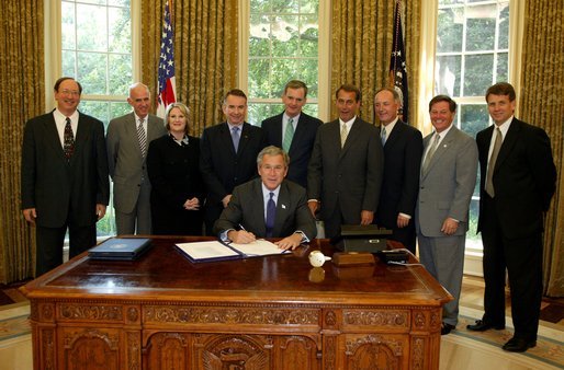  President George W. Bush signs S. 342, the Keeping Children and Families Safe Act of 2003, in the Oval Office Wednesday, June 25, 2003. The act reauthorizes the Child Abuse Prevention and Treatment Program and other related programs. White House photo by Susan Sterner.