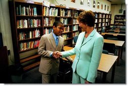 Laura Bush meets a student as she tours the library of Dimner Beeber Middle School in Philadelphia, Pa., June 25, 2003.  White House photo by Tina Hager