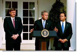Announcing the national "Do Not Call Registry," President George W. Bush stands with Federal Trade Commission Chairman Timothy Muris, left, and Federal Communications Commission Chairman Michael Powell in the Rose Garden Friday, June 28, 2003. The registry protects privacy by blocking incoming telemarketing calls.  White House photo by Susan Sterner