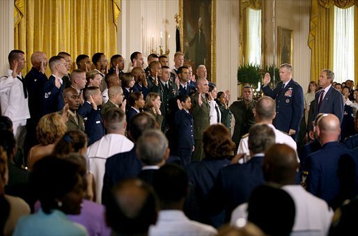 Marking the 30th anniversary of the All-Volunteer Force that constitutes America's military, President George W. Bush watches as Chairman of the Joint Chiefs of Staff General Richard Myers conducts a reenlistment service in the East Room Tuesday, July 1, 2003. White House photo by Eric Draper