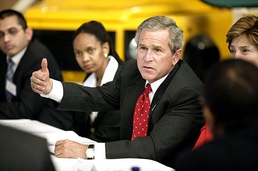President George W. Bush talks with Ford Motor Company employees at the company's plant near Pretoria, South Africa, Wednesday July 9, 2003. White House photo by Paul Morse