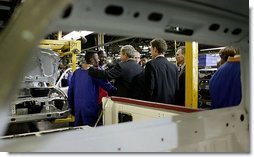 President George W. Bush meets one-on-one with workers at the Ford Motor Company plant near Pretoria, South Africa, Wednesday, July 9, 2003.  White House photo by Paul Morse