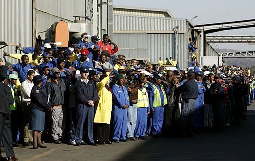 Workers at the Ford Motor Company plant watch as President Bush departs the plant near Pretoria, South Africa, Wednesday July 9, 2003. White House photo by Paul Morse.