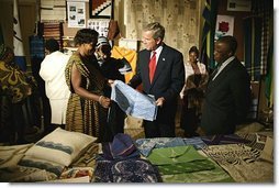President George W. Bush participates in a tour of the Southern Africa Global Competitiveness Hub with President Festus Gontebanye Mogae of Botswana Thursday, July 10, 2003. 