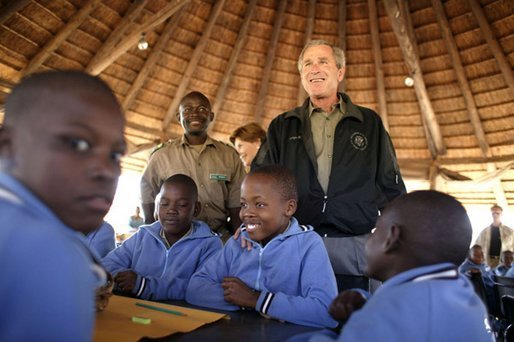 President George W. Bush talks to students attending nature classes at the Mokolodi Nature Reserve near Gaborone, Botswana Thursday, July 10, 2003. White House photo by Paul Morse.