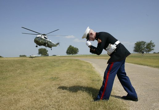 Italian Prime Minister Silvio Berlusconi arrives aboard a Marine helicopter at the Bush Ranch in Crawford, Texas, Sunday, July 20, 2003. White House photo by Eric Draper.