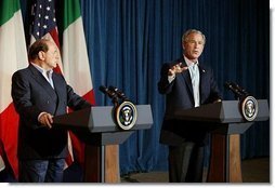President George W. Bush welcomes Silvio Berlusconi, the Prime Minister of Italy, after his arrival at the Bush Ranch in Crawford, Texas, Sunday, July 20, 2003.  White House photo by Paul Morse