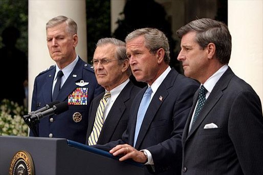 Listing recent achievements reached in Iraq, President George W. Bush holds a press conference in the Rose Garden, Wednesday, July 23, 2003. Standing with the President are Chairman of the Joint Chiefs of Staff General Richard Myers, Secretary of Defense Donald Rumsfeld and Presidential Envoy to Iraq Ambassador Paul Bremer. White House photo by Paul Morse.