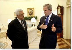 President George W. Bush and Palestinian Prime Minister Mahmoud Abbas meet in the Oval Office Friday, July 25, 2003. Meeting for the first time at the White House, the two leaders also held a working lunch and a joint press conference in the Rose Garden.  White House photo by Eric Draper