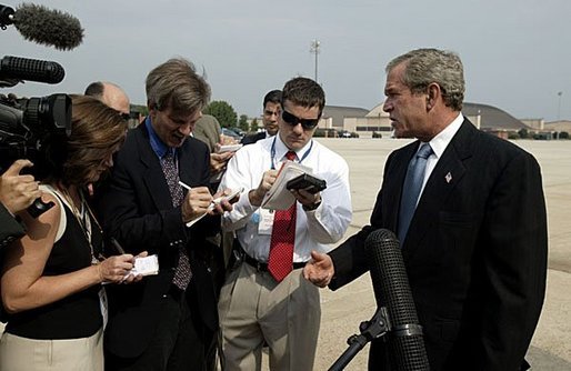 President George W. Bush discusses the death of entertainer with the press Bob Hope as he boards Air Force One July 28, 2003. "Today America lost a great citizen. We mourn the passing of Bob Hope. Bob Hope made us laugh, and he lifted our spirits. Bob Hope served our nation when he went to battlefields to entertain thousands of troops from different generations," said the President. White House photo by Paul Morse.