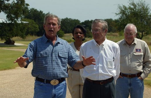 President George W. Bush and Secretary of Defense Donald Rumsfeld, accompanied by Vice President Dick Cheney and National Security Advisor Condoleezza Rice, answer questions from members of the media outside the President's Crawford, Texas, home Friday, Aug. 8, 2003. White House photo by David Bohrer
