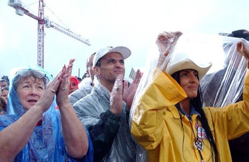 President George W. Bush is welcomed by members of the Union of Operating Engineers on a rainy Labor Day in Richfield, OH., Monday, Sept. 1, 2003. White House Photo by Tina Hager, White House photo by Tina Hager.