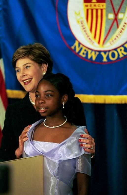 Laura Bush introduces 6th grader Arianna Gouldbourne during visit to Mercy College in New York City, to launch new teacher preparation program for the New York City Teaching Fellows, titled “Teaching for Results”, Sept. 2, 2003. White House photo by Susan Sterner.