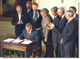President George W. Bush signs the Chile and Singapore Free Trade Agreement Implementation Acts in the East Room Wednesday, Sept. 3, 2003.  White House photo by Tina Hager