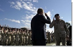 President George W. Bush salutes Major General Buford Blount, Commander of the 3rd Infantry Division (Mechanized) before addressing military personnel and their families at Ft. Stewart, Ga., Friday, Sept. 12, 2003.  White House photo by Paul Morse