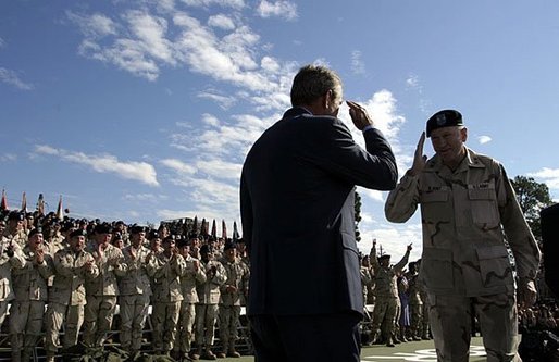 President George W. Bush salutes Major General Buford Blount, Commander of the 3rd Infantry Division (Mechanized) before addressing military personnel and their families at Ft. Stewart, Ga., Friday, Sept. 12, 2003. White House photo by Paul Morse.