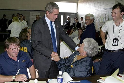 After delivering remarks about Hurricane Isabel, President George W. Bush personally thanks FEMA staff at the temporary operations center housed at the Virginia State Police Academy in Richmond, Va., Monday, Sept. 22, 2003. "There's a lot of neighborliness taking place in the state of Virginia and North Carolina and Maryland, where if somebody hurts and somebody's lonely, somebody needs help is finding refuge and solace because a fellow citizen has taken it upon him or herself to help somebody in need," said the President. White House photo by Paul Morse