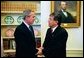 President George W. Bush and President Nicanor Duarte of Paraguay talk in the Oval Office Friday, Sept. 26, 2003. White House photo by Tina Hager