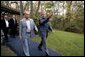 President George W. Bush escorts President Vladimir Putin of Russia after his arrival at Camp David, Friday, Sept. 26, 2003.  White House photo by Eric Draper