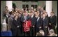 President George W. Bush poses with the 2003 Stanley Cup Champion New Jersey Devils ice hockey team Monday afternoon, September 29, 2003, in the Rose Garden. White House photo by Jennifer Smith.