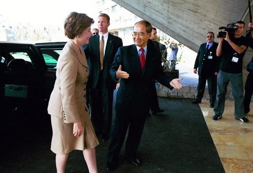 Laura Bush is welcomed to UNESCO headquarters in Paris by UNESCO director Koichiro Matsuura for formal ceremonies celebrating the renewed participation of the United States Sept. 9, 2003. White House photo by Susan Sterner
