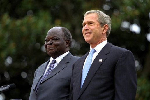 Presidents Bush and Kibaki watch the military review portion of the State Arrival Ceremonies on the South Lawn of the White House Monday, October 5, 2003. White House photo by Susan Sterner