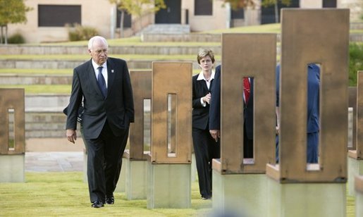 Vice President Dick Cheney walks with Don Ferrell (not pictured) through the Field of Empty Chairs to the chair of Susan Ferrell, Don Ferrell’s daughter, at the Oklahoma City National Memorial in Oklahoma City, Okla., Oct. 9, 2003. The field contains 168 chairs, one for each person who died in the bombing of the Federal Building. White House photo by David Bohrer.