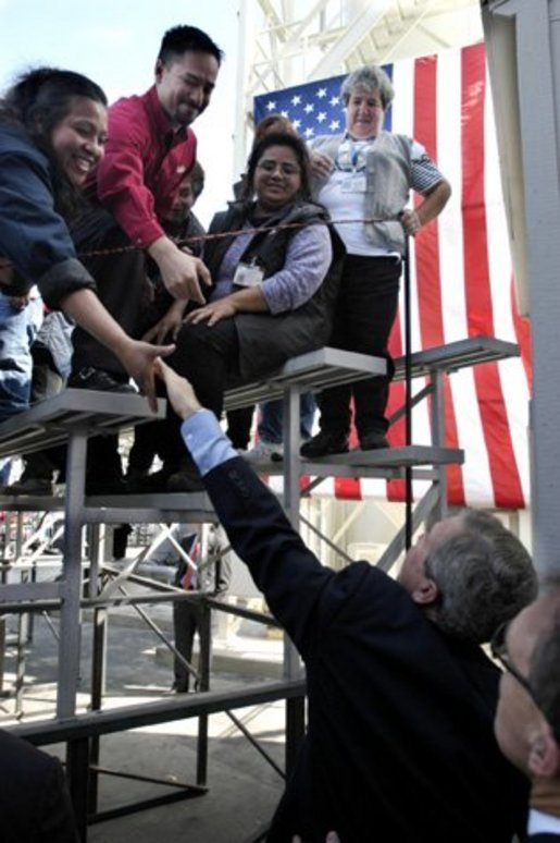 President George W. Bush greets employees at Ruiz Foods after speaking on housing and the economy in Dinuba, Calif., Wednesday, Oct. 15, 2003. White House photo by Eric Draper.