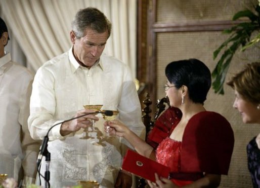 President George W. Bush toasts with Philippine president Gloria Arroyo during a state dinner in Manila, The Philippines on Saturday October 18, 2003. White House photo by Paul Morse.