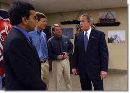 President George W. Bush meets with small business owners during a visit to CraneWorks' equipment warehouse in Birmingham, Ala., Monday, Nov. 3, 2003. Pictured with President Bush are Rom Reddy, CEO of Nexcel Synthetics, left, and brothers David, center, and Steve Upton, President and Vice President of CraneWorks.  White House photo by Eric Draper
