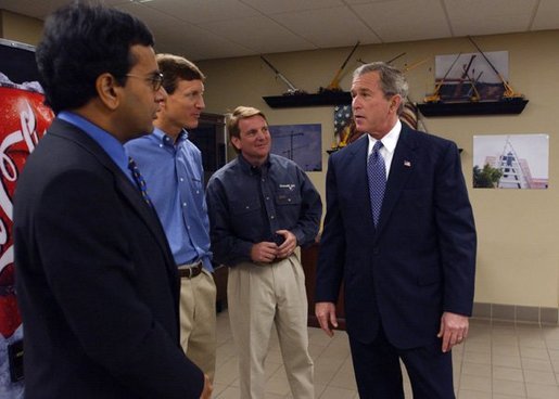 President George W. Bush meets with small business owners during a visit to CraneWorks' equipment warehouse in Birmingham, Ala., Monday, Nov. 3, 2003. Pictured with President Bush are Rom Reddy, CEO of Nexcel Synthetics, left, and brothers David, center, and Steve Upton, President and Vice President of CraneWorks. White House photo by Eric Draper