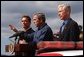 President George W. Bush stands with California Governor-elect Arnold Schwarzenegger, left, and California Governor Gray Davis as he addresses firefighters in El Cajon, Calif., Tuesday, Nov. 4, 2003. White House photo by Eric Draper
