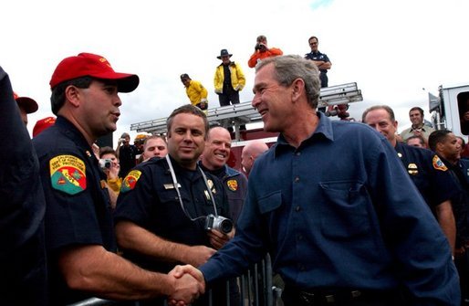 President George W. Bush greets firefighters after speaking in El Cajon, Calif., Tuesday, Nov. 4, 2003 White House photo by Eric Draper.