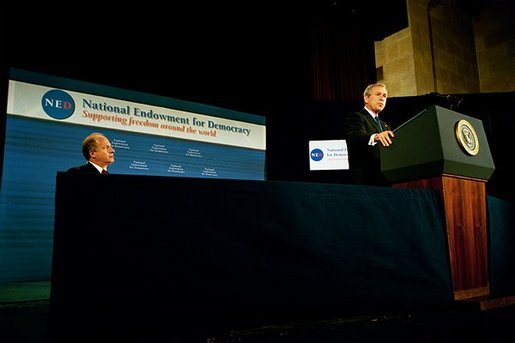 President George W. Bush delivers remarks at the 20th Anniversary of the National Endowment for Democracy at the U. S. Chamber of Commerce Thursday, Nov. 6, 2003. Pictured with President Bush is Vin Weber, the endowment's chair and former Congressman from Minnesota. 