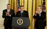President George W. Bush delivers remarks at the signing of The Emergency Supplemental Appropriations Act for Defense and for The Reconstruction of Iraq and Afghanistan in the East Room Thursday, Nov. 6, 2003. Pictured with the President are Secretary of State Colin Powell, left, and Defense Secretary Donald Rumsfeld.  White House photo by Susan Sterner