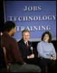 President George W. Bush chats with students about education and job training at Forsyth Technical Community College in Winston-Salem, N.C., Friday, Nov. 7, 2003  White House photo by Paul Morse