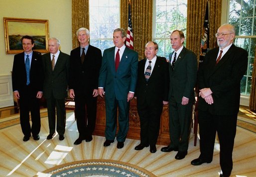 President George W. Bush meets with six of the 2003 recipients of the Nobel Awards in the Oval Office Monday, November 17, 2003. From left to right, Nobel Award recipients are: Dr. Rokerick MacKinnon, New York City (chemistry); Dr. Anthony Leggett, Urbana, Illinois (physics); Dr. Robert Engle, New York City (economics); Dr. Alexei Abrikosov, Argonne, Illinois (physics); Dr. Peter Agre, Baltimore, Maryland (chemistry); and Dr. Paul Lauterbur, Urbana, Illinois (physiology/medicine). White House photo by Tina Hager