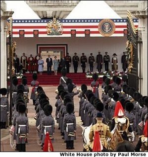 President George W. Bush and Laura Bush listen to the playing of America's national anthem during an official welcome ceremony at Buckingham Palace in London, Wednesday, Nov. 19, 2003. Standing with them are Her Majesty Queen Elizabeth and Prince Philip, Duke of Edinburgh. The President and Mrs. Bush last visited Buckingham Palace July of 2001. White House photo by Paul Morse.