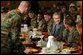President George W. Bush enjoys lunch with U.S. soldiers at Fort Carson, Colorado Nov. 24, 2003. White House photo by Tina Hager