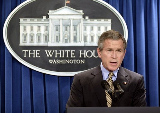 President George W. Bush makes a statement to the press on Libya agreeing to dismantle its weapons of mass destruction program on Friday December 19, 2003. White House photo by Paul Morse