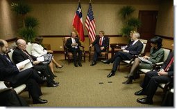 President Ricardo Lagos of Chile and President George W. Bush meet during the Special Summit of the Americas in Monterrey, Mexico, Jan. 12, 2004.  White House photo by Eric Draper