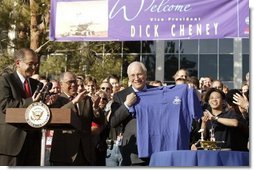 After congratulating NASA staff on the successful landing of the robotic rover Spirit on Mars, Vice President Dick Cheney holds up a shirt bearing the Spirit emblem at the Jet Propulsion Laboratory in Pasedena, Calif., Jan. 14, 2004.  White House photo by David Bohrer